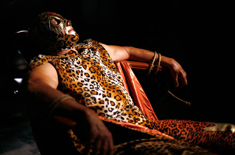 Mexican wrestler Mil Mascaras relaxes before acting in a scene in the film <em>Venganza Azteca</em>. In the scene, Mil is tied up and is forced to undergo a brain scan.